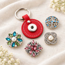 Round PU Leather Sandy Snap Interchangeable Charm Keychain plain base beside four separate decorative snaps; styling choices